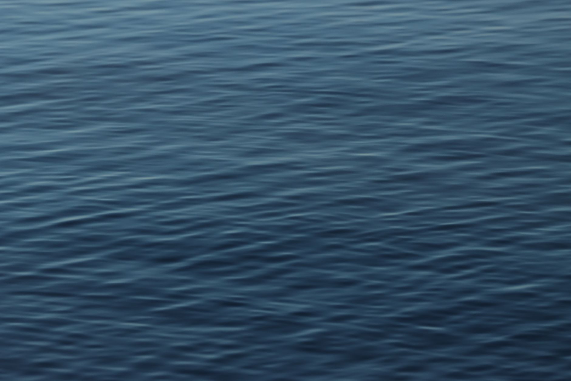 Calm and rippled water surface in Jönköping, highlighting serene nature.