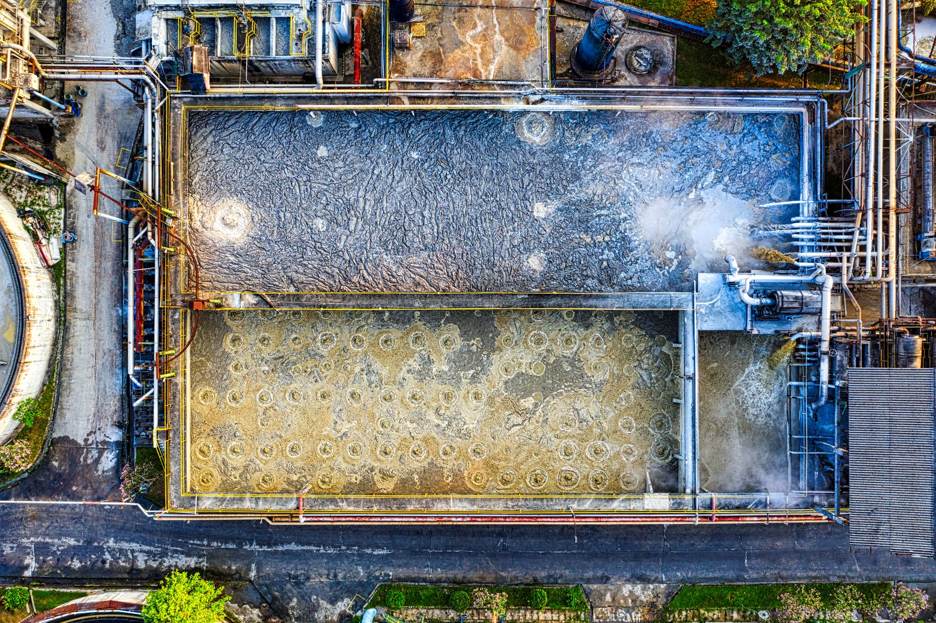 Overhead shot of a water treatment plant highlighting industrial processes.