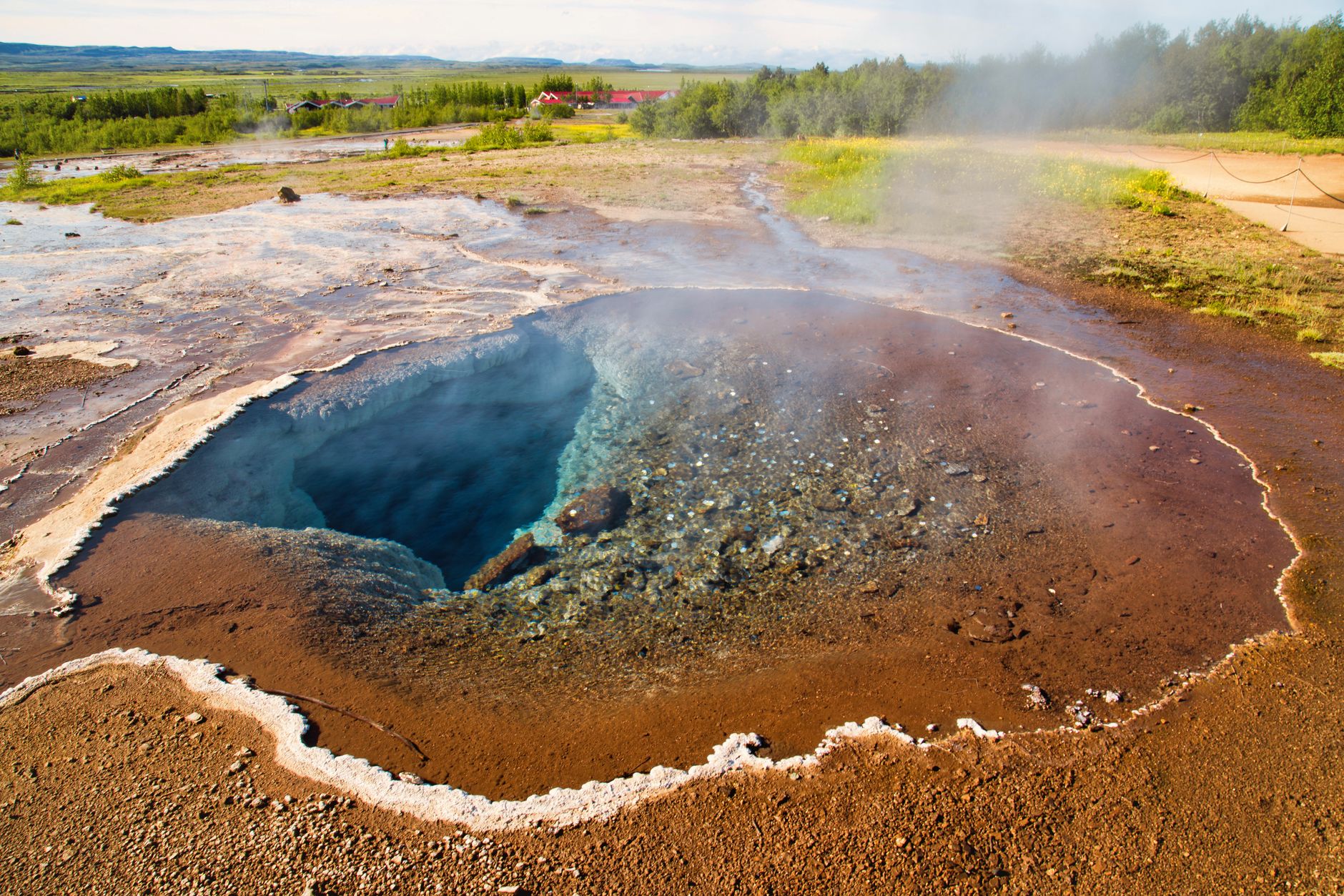 Explore the stunning geothermal hot spring and geyser in the scenic landscapes of Reykjavík, Iceland.