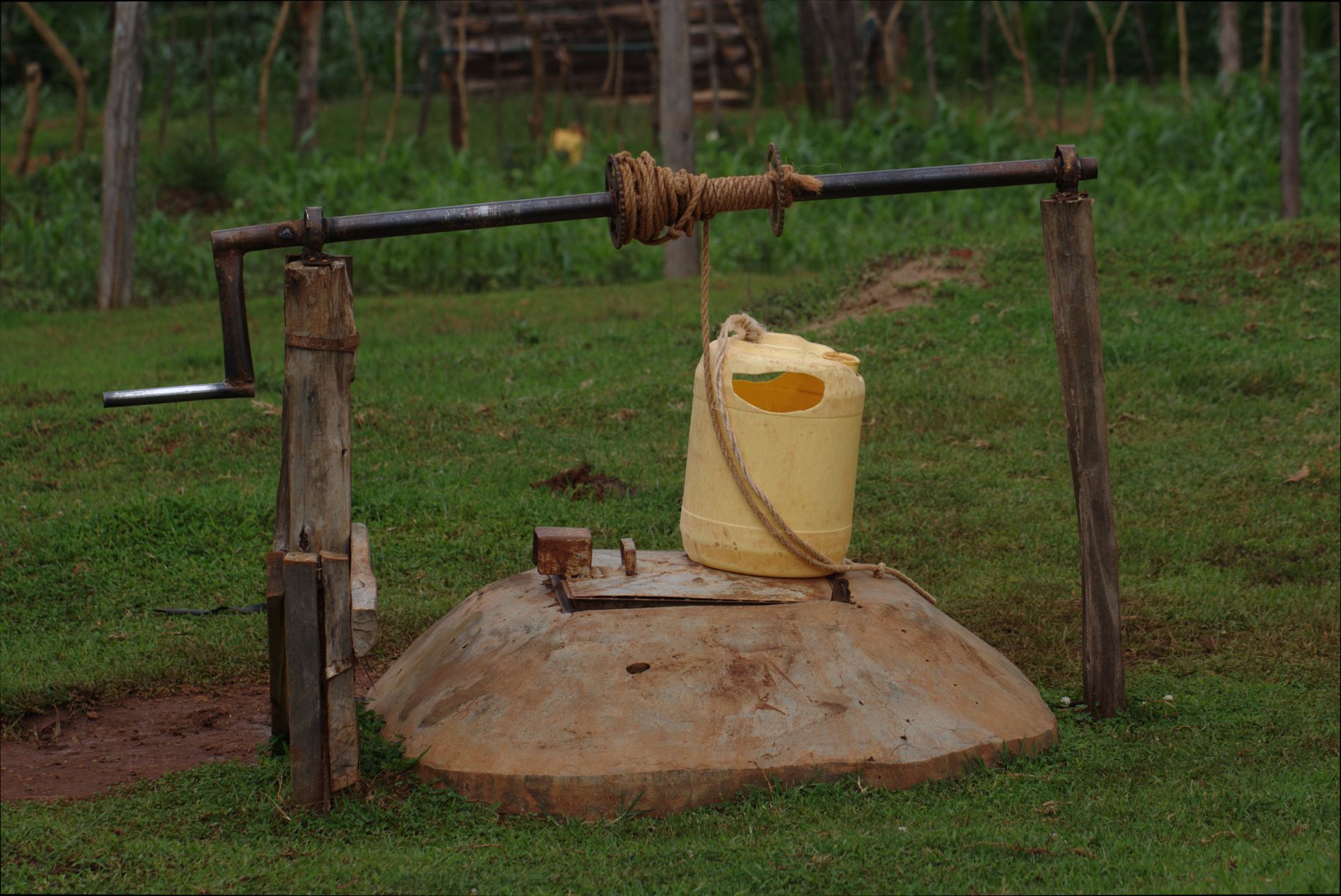 Rustic well with a yellow container in rural Kitale, Kenya.