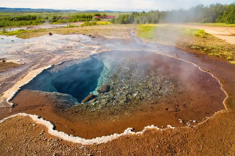Explore the stunning geothermal hot spring and geyser in the scenic landscapes of Reykjavík, Iceland.